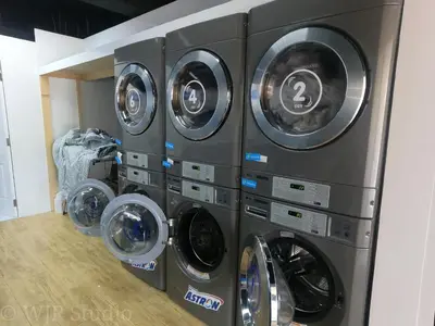four washing machines stacked on top of each other at Choco Condotel- Anuva Prime 1 Couple Suite Lakeview in Manila