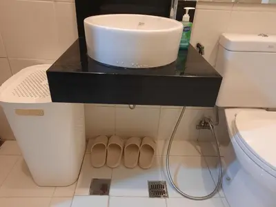 a bathroom with a sink and a toilet at The Rochester in Manila