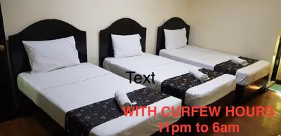 three twin beds in a room with the words text with curry hoursarma to gain at Grand Traveler Suite Inc in Manila