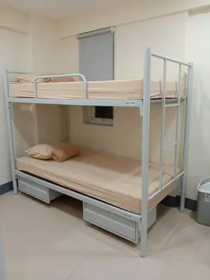 a couple of bunk beds in a room at Snoozeph in Manila