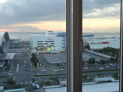 a view of a parking lot from a window at manila sea view homes 21 in Manila