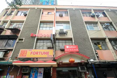 a tall building with a for future sign in front of it at RedDoorz Plus @ Chinatown Binondo in Manila