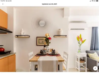 a dining room table with a table cloth on it at The Rustic Haven-1 in Manila