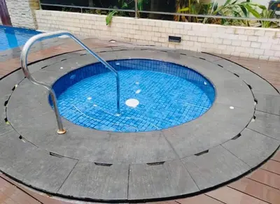 a small swimming pool with a metal rail around it at Favila Condotel Unit-150 Newport Boulevard near Airport Terminal 3 and all other Airport in Manila