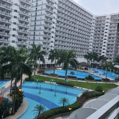 an aerial view of a large apartment complex with a large swimming pool at SHELL RESIDENCES in Manila