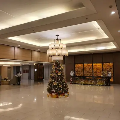 a christmas tree in the middle of a lobby at SHELL RESIDENCES in Manila