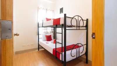 a room with two bunk beds in a room at RedDoorz Plus at Alpina Heights Paranaque in Manila