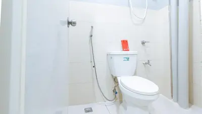 a bathroom with a toilet and a shower at RedDoorz near Pasay Rotonda in Manila