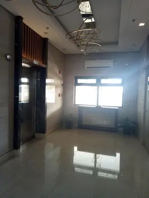 a room with a hallway with a door and a window at Spring Residence in Manila