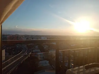 a view of the sun setting from a building at Spring Residence in Manila