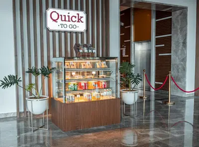 a display case in a building with drinks in it at Kingsford Hotel Manila Bay in Manila