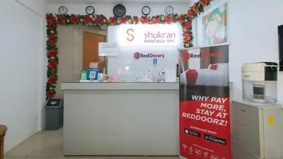 a store with a cash counter in a store at RedDoorz Plus near Tambo Paranaque in Manila