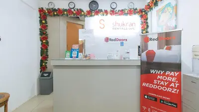 a store with a christmas display in a room at RedDoorz Plus near Tambo Paranaque in Manila