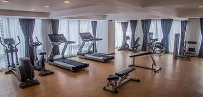 a gym with a bunch of exercise bikes in it at Y2 Residence Hotel Managed by HII in Manila