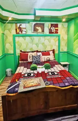 a bedroom with a bed in a room with aintendent at Cubao Quezon city Transient condo unit in Manila