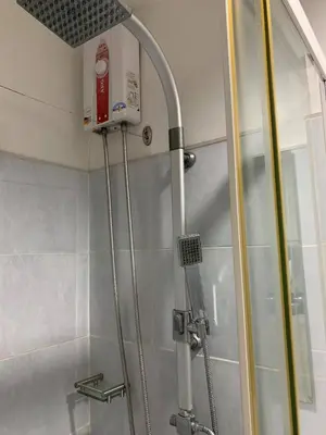 a shower in a bathroom with a shower at Wind and Sea at Sea Residences in Manila