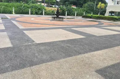 a large courtyard with a fountain in the middle at CENTROPOLIS 4, Fun & Playful in Manila