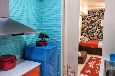 a room with a blue brick wall at CENTROPOLIS 3, Tropical Modern in Manila
