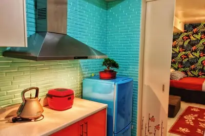 a kitchen with a teapot and a kettle on a counter at CENTROPOLIS 3, Tropical Modern in Manila