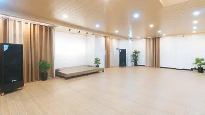 a large empty room with a stage and a tv at RedDoorz at RJs Bldg near Lyceum Gen Trias Cavite Cion Suites in General Trias
