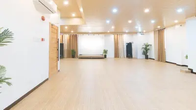 a large room with a wooden floor and a large window at RedDoorz at RJs Bldg near Lyceum Gen Trias Cavite Cion Suites in General Trias
