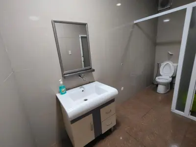 a bathroom with a sink and a toilet at La Belladoza near NAIA T1 Airport in Manila