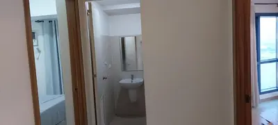 a white bathroom with a sink and a toilet at Magnificent View of Manila Bay, Roxas Blvd, US Embassy in Manila