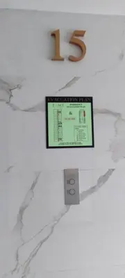 a tv on a wall with a number on it at Family Suite Staycation FAME Residence 1508 Tower1 in Manila