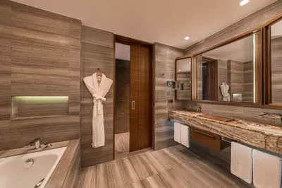 a bathroom with a bath tub and a sink at Marco Polo Ortigas Manila in Manila