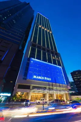 a maimonides hospital building at night with cars in front at Marco Polo Ortigas Manila in Manila