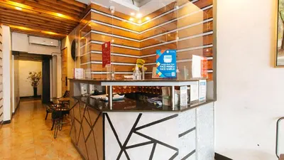 a bar in a restaurant with a counter at RedDoorz @ Good 101 Quiricada Manila in Manila