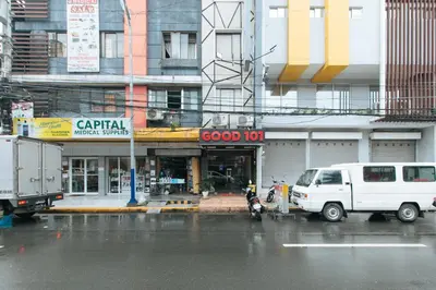 a white van parked in front of a good store at RedDoorz @ Good 101 Quiricada Manila in Manila