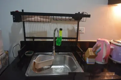 a kitchen sink with a faucet on a counter at Paranaque SM-Sucat Field Res. Bldg 5, 2/F, 2BR with Balcony in Manila