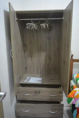 a wooden cabinet with two drawers in a bedroom at Paranaque SM-Sucat Field Res. Bldg 5, 2/F, 2BR with Balcony in Manila