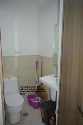a bathroom with a toilet and a sink at Paranaque SM-Sucat Field Res. Bldg 5, 2/F, 2BR with Balcony in Manila