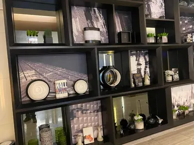 a black shelf with a tv in a room at Staycation Taft Ave DLSU Green Res by darpm in Manila