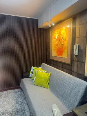 a room with a bed with a yellow pillow on it at FRD Condo Unit Tower A SoleMare Parksuites in Manila