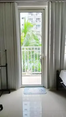 an open door in a room with a window at SHORE RESIDENCE d6, shortwalk Mall of Asia near Airport in Manila