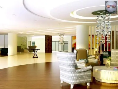 a lobby with white chairs and a chandelier at SHELL RESIDENCE c5, shortwalk MALL OF ASIA near Airport in Manila
