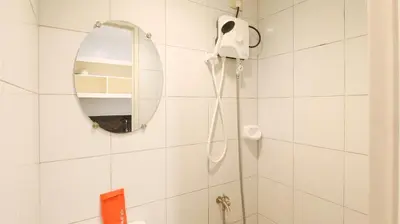 a bathroom with a shower and a mirror at RedDoorz @ Malibu Room BF International Las Pinas in Manila