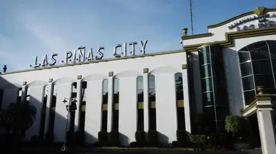 a building with the words las palms city on it at RedDoorz @ Malibu Room BF International Las Pinas in Manila