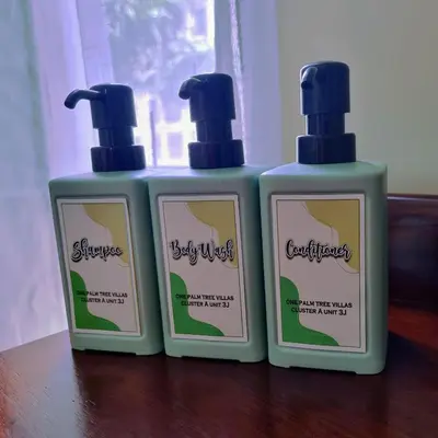 two bottles of soap sitting on top of a table at One Palm Tree Villas Condo Across NAIA Terminal 3 in Manila