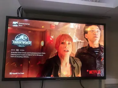 a television screen with a movie on it at Cozy Boo Bed and Breakfast near Enchanted Kingdom by Dynel in Santa Rosa