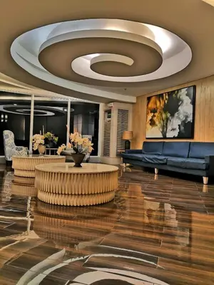 a lobby with a couch and a table in a building at SHELL RESIDENCE c3 shortwalk mall of asia near airport in Manila