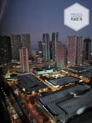 a view of a city at night with tall buildings at Mack's Awesome 15 with Netflix and FastUnliwifi in Manila