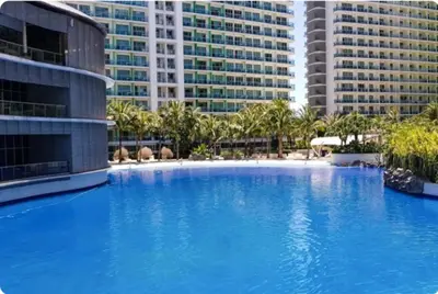 a large blue swimming pool in front of tall buildings at AZURE URBAN RESORT - PARANAQUE MANILA NEAR TERMINAL UNLIMITED WIFI and Netflix in Manila