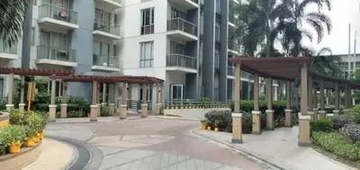 an empty courtyard of a large apartment building at One Palm Tree Villas NAIA TERMINAL 3 in Manila