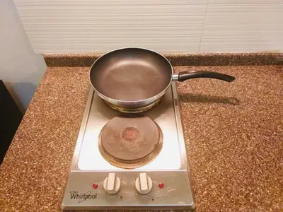 a pot sitting on top of a stove at The Sentinel Residences in Manila
