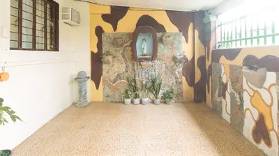 a hallway with a mural on the wall at JBs Transient House in General Trias