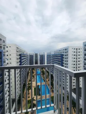 a balcony with a view of some buildings at Sea Residences TowerE-F by EZStays in Manila
